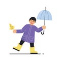 Boy with an umbrella and an autumn leaf. Boy wearing a raincoat and yellow rubber boots.