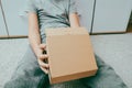 A boy unboxing unpacking a parcell, delivery, online shopping purchase concept