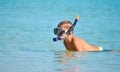 The child in the sea with the marine tube. scuba diving at sea. The boy in the glasses on the ocean Royalty Free Stock Photo