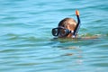 The child in the sea with the marine tube. scuba diving at sea. The boy in the glasses on the ocean Royalty Free Stock Photo