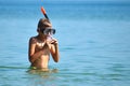 The child in the sea with the marine tube. scuba diving at sea. The boy in the glasses on the ocean Royalty Free Stock Photo