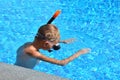 Baby boy in the water mask in the pool. Child swimmer in the water autdoor. Royalty Free Stock Photo
