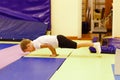 Boy in uniform doing handstand.Children`s yoga. Exercise crocodile Royalty Free Stock Photo