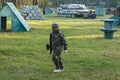 Boy in uniform with paintball gun and helmet on the field. Sport, active lifestyle Royalty Free Stock Photo