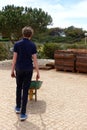 Boy unloading rolls of turf