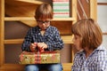 Boy unwrapping a Christmas present