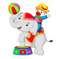 A boy uses a clown costume with an elephant while playing circus