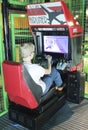 A Boy Uses a Flight Simulator at the Discovery Children`s Museum