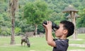 Boy using binoculars in zoo Royalty Free Stock Photo