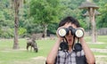 Boy using binoculars in zoo Royalty Free Stock Photo