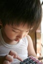 Boy using calculator Royalty Free Stock Photo