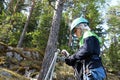 Boy using carabiner of safety equipment Royalty Free Stock Photo