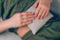 Boy using cherry stone thermal pillows cherry pit filled pillow - natural heat or cool pack. Alternative medicine and therapy 