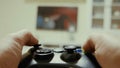 Boy using a controller to play a video-game Royalty Free Stock Photo