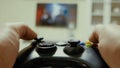 Boy using a controller to play a video-game Royalty Free Stock Photo