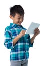 Boy using digital tablet against white background Royalty Free Stock Photo