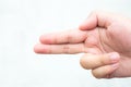 A boy using his hand as a gun, shooting or pointing to the left Royalty Free Stock Photo