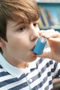 Boy Using Inhaler To Treat Asthma Attack Royalty Free Stock Photo