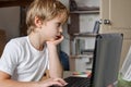 Boy using laptop home Royalty Free Stock Photo