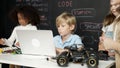 Boy using laptop programing engineering code and writing program. Erudition. Royalty Free Stock Photo