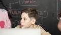 Boy using laptop programing engineering code and writing program. Erudition. Royalty Free Stock Photo
