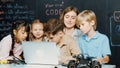 Boy using laptop programing engineering code and writing program. Erudition. Royalty Free Stock Photo