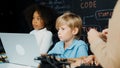 Boy using laptop programing engineering code and writing program. Erudition. Royalty Free Stock Photo