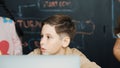 Boy using laptop programing engineering code and writing program. Erudition. Royalty Free Stock Photo