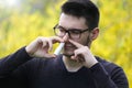 Boy using nose inhaler in park Royalty Free Stock Photo