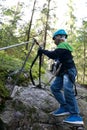 Boy using safety climbing equipment Royalty Free Stock Photo