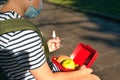 Boy using sanitizer or disinfectant spray for disinfecting hands, before having lunch at school. Back to school after Royalty Free Stock Photo