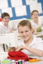 Boy using a sewing machine