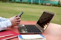 Boy is using smartphone with laptop Royalty Free Stock Photo