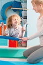 Boy using therapy swing Royalty Free Stock Photo