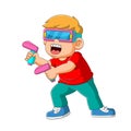 The boy using the virtual game with the gun remote in his hand Royalty Free Stock Photo