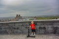 A boy with a view of Yerevan from Tsitsernakaberd-the Armenian genocide memorial complex is the official monument to the Royalty Free Stock Photo