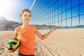 Boy volleyball player next to the net with ball Royalty Free Stock Photo