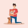 Boy volunteer with dog and food donation Royalty Free Stock Photo