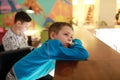 Boy waiting food at bar of restaurant Royalty Free Stock Photo