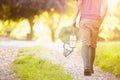 Boy Walking Along Path Carrying Fishing Net And Jar Royalty Free Stock Photo