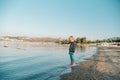 Boy walking on the beach