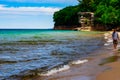 Boy Walking on Beach at Picture Rocks, Michigan Royalty Free Stock Photo