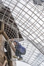 Boy walking in metal wired tunnels above ground