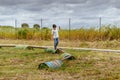 Boy walking over barrels in playground area at Spanish Aerodrome.