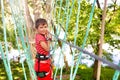 Boy walking on the ropes at adventure summer camp Royalty Free Stock Photo