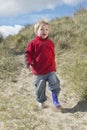 Boy Walking On Sand At Beach Royalty Free Stock Photo