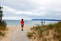 Boy walking to beach Royalty Free Stock Photo