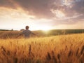 Boy walking through wheat field Royalty Free Stock Photo