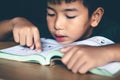 The boy was reading a book in a quiet room, Concept read a book Royalty Free Stock Photo