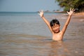 The boy was very happy to play in the sea. Royalty Free Stock Photo